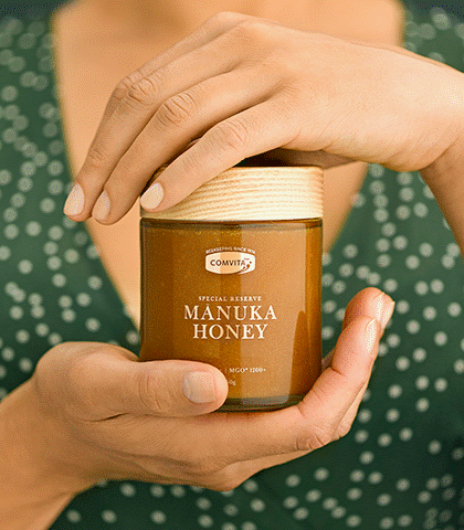 UMF™ 25+ Manuka Honey 250g jar in hands